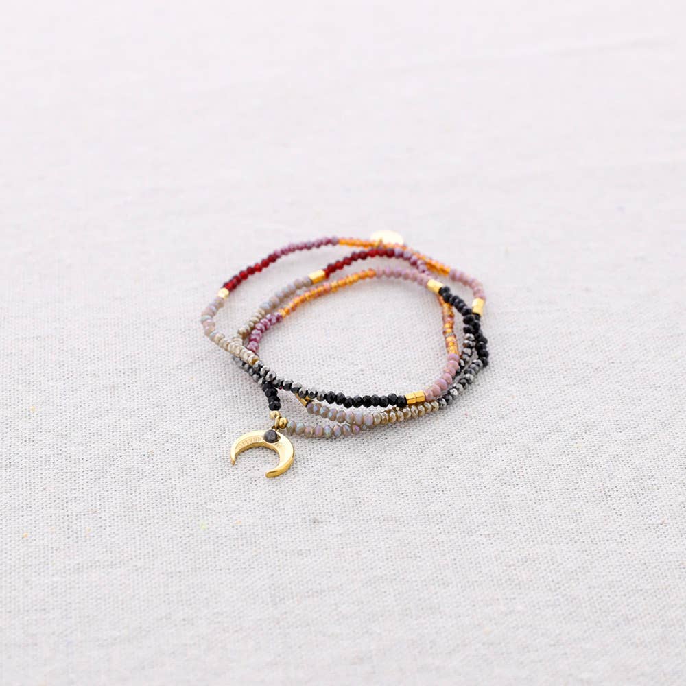 Bracelet extensible en acier avec perles et pendentif corne