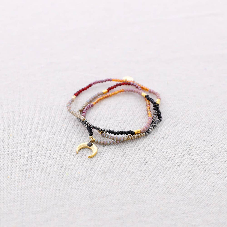 Bracelet extensible en acier avec perles et pendentif corne