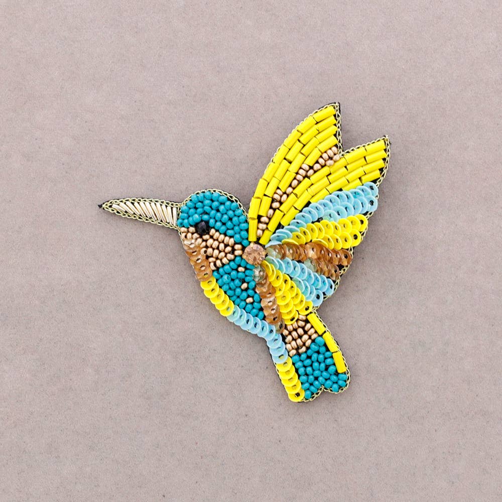 Broche oiseau en perles