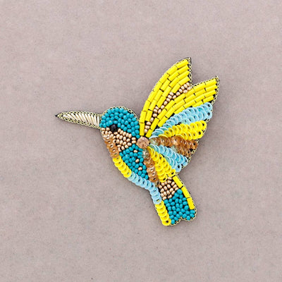 Broche oiseau en perles