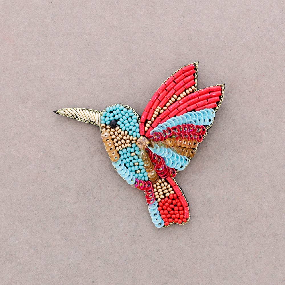 Broche oiseau en perles