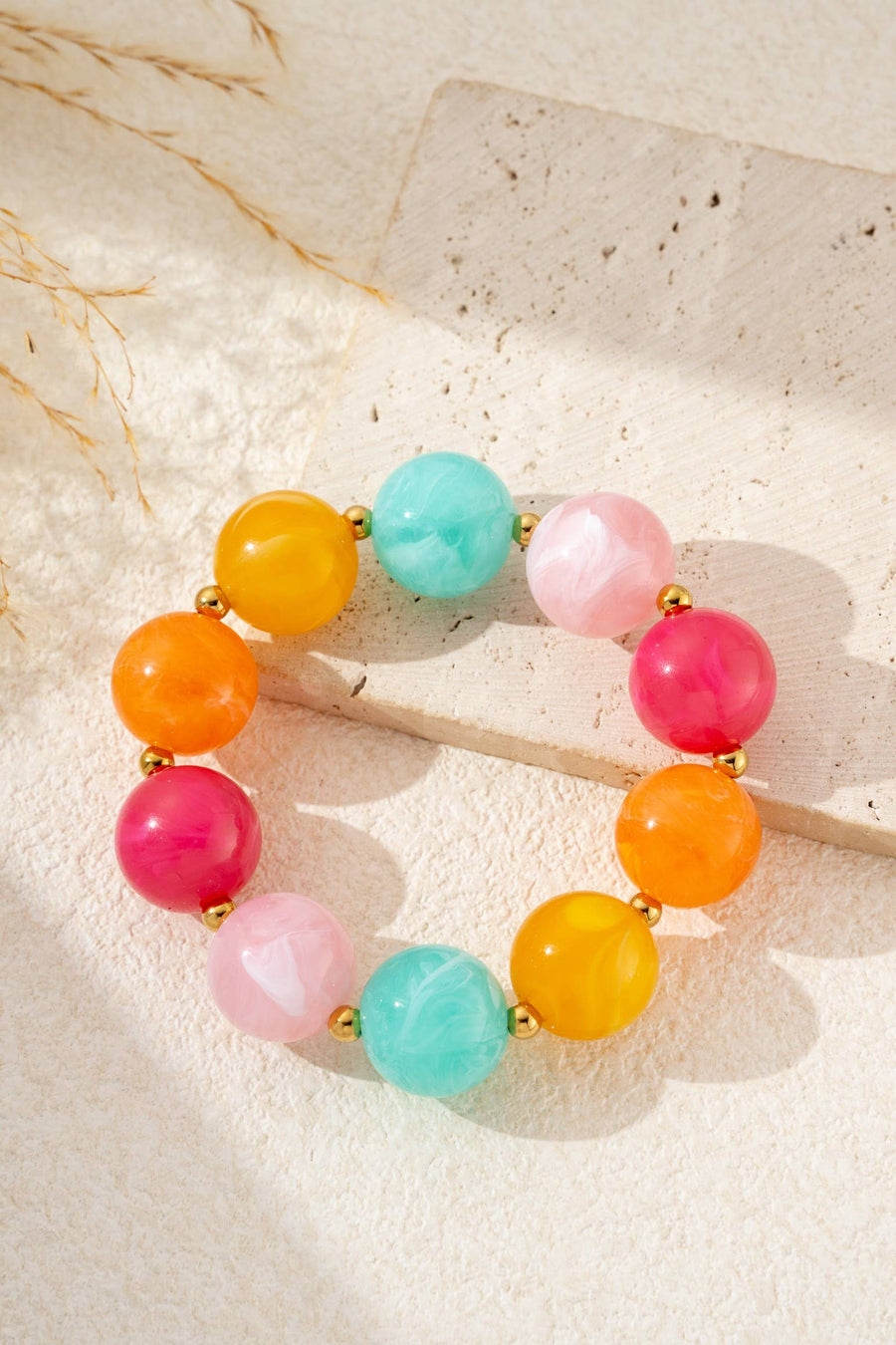 Bracelet élastique perles résine marbrée acier inoxydable